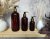 Hnědá lahvička se zlatou pumpičkou - objem 100/250/500 ml